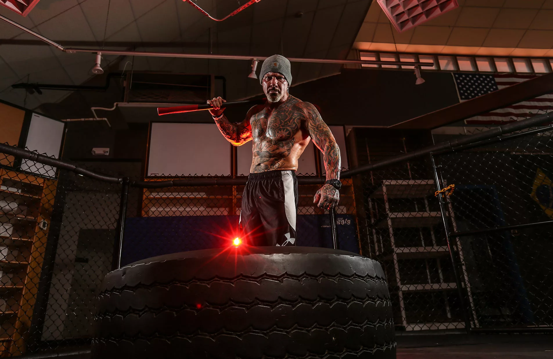 Rick training with a sledgehammer on a tire